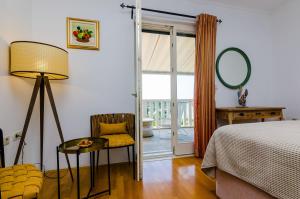 Postel nebo postele na pokoji v ubytování Villa La Vagabonda Apartment