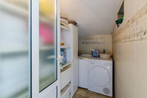 Kuchyň nebo kuchyňský kout v ubytování Villa La Vagabonda Apartment