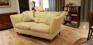 a white couch with pillows on it in a living room at 138a Old Star & Garter in Ludlow