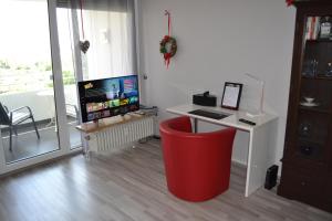 TV a/nebo společenská místnost v ubytování Ferienwohnung Am Steinberg