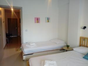 Postel nebo postele na pokoji v ubytování Ioannas