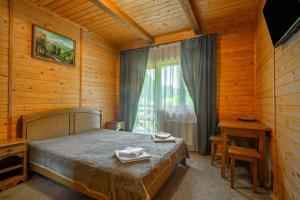 Postel nebo postele na pokoji v ubytování Arnika Hotel