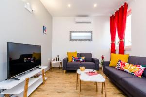 TV a/nebo společenská místnost v ubytování Apartment Moon River