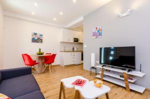 TV a/nebo společenská místnost v ubytování Apartment Moon River