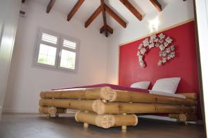 Postel nebo postele na pokoji v ubytování MAISON TI BAMBOU + 13 fotografií