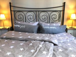 a bedroom with a bed with stars on it at moevDECK in Heiligenhafen