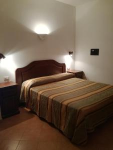 Ένα ή περισσότερα κρεβάτια σε δωμάτιο στο Agriturismo Sant'Erasmo