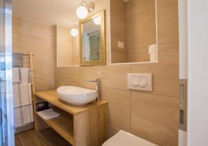Koupelna v ubytování Apartmani Kraj mora
