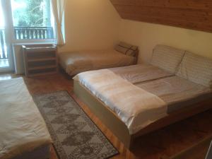 Postel nebo postele na pokoji v ubytování Apartman Luca