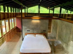 a large room with a bed in the middle at Sati Villa Kandy Sri Lanka in Kandy