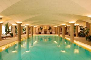 a large swimming pool in a hotel lobby at Grantley Hall in Ripon