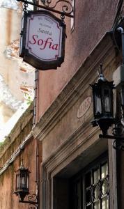 a sign for a santa solla on the side of a building at Alloggi Santa Sofia in Venice