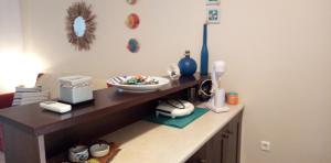 a kitchen counter with a bowl of food on it at studio στην θαλασσα in Koropi