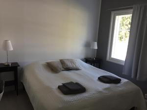 Łóżko lub łóżka w pokoju w obiekcie Villa Kuusela