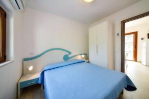 A bed or beds in a room at Residence Palm Beach
