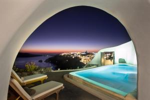 a swimming pool in a villa with a view at Perivolas Hotel in Oia