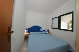 A bed or beds in a room at Residence Palm Beach