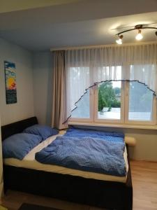 Posteľ alebo postele v izbe v ubytovaní Wohnung