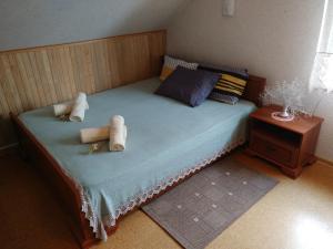 Mini spa Harmonija tesisinde bir odada yatak veya yataklar
