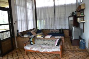 Uma área de estar em Pousada Alto do Cajueiro