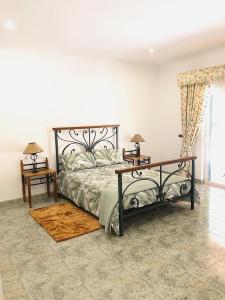מיטה או מיטות בחדר ב-Quinta da Falfeira