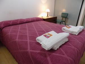 Una cama o camas en una habitación de Hotel Belgrano
