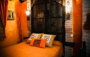 Giường trong phòng chung tại Casa rural La Antigua Vaqueria