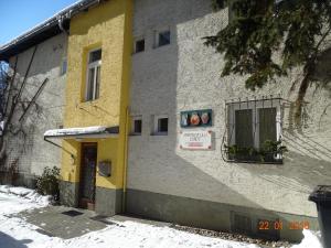 a yellow and gray building with a window at Ulli 1 in Zell am See