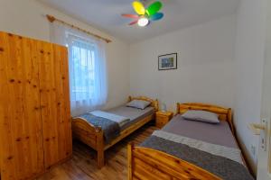 Кровать или кровати в номере Zsoryka Vendégház