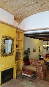 a bedroom with a bed and a mirror on a wall at Casa Magica in Olhão