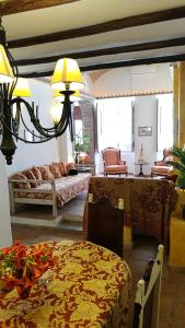 a living room with a bed and a table at Casa Magica in Olhão