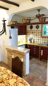 a kitchen with a counter top in a room at Casa Magica in Olhão +37 photos