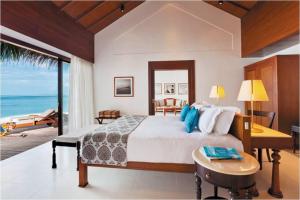 Postel nebo postele na pokoji v ubytování The Residence Maldives