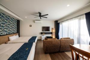 Ένα ή περισσότερα κρεβάτια σε δωμάτιο στο The Peridot Smart Hotel Tancha Ward +93 φωτογραφίες