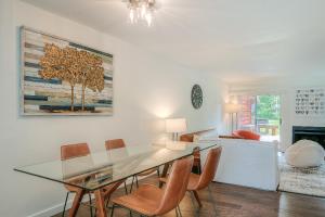 a dining room with a glass table and chairs at Moon River Suites #5 in North Bend