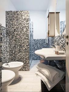 a bathroom with a sink and a toilet at Great Apts Few Steps to The Duomo in Florence