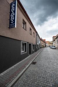an empty street with a sign on the side of a building at Apartamenty ZYGFRYD 28C 2 in Bystrzyca Kłodzka