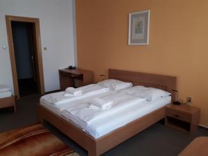 Posteľ alebo postele v izbe v ubytovaní Hotel Maria