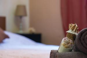 a piece of cake sitting on a chair in a bedroom at James Room in Samos