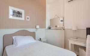 Postel nebo postele na pokoji v ubytování Miramare Hotel