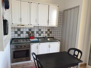 Kuchyň nebo kuchyňský kout v ubytování case vacanze, La casa di Angelo, con terrazzo