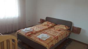 Postel nebo postele na pokoji v ubytování Apartman Lela