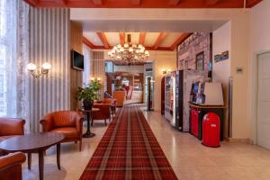 a hotel lobby with a rug on the floor at Avenue Hotel in Amsterdam