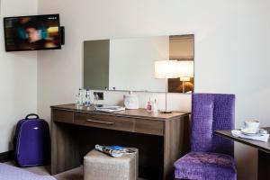 Televiisor ja/või meelelahutuskeskus majutusasutuses Brandon House Hotel
