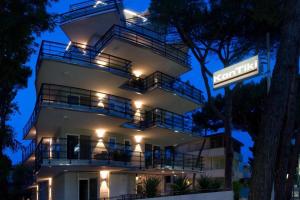 a lit up building with a sign in front of it at Kontiki in Milano Marittima