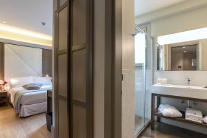 Postel nebo postele na pokoji v ubytování Hotel Martis Palace