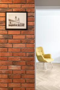 Posedenie v ubytovaní Apartament Ogród Krasińskich