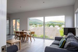 a living room with a couch and a table at The Views in Newcastle