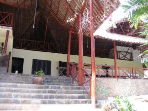 a group of stairs in front of a building at Kiloran Funzi House in Funzi