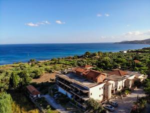 an aerial view of a building and the ocean at ZagaMilos Hotel in Koroni